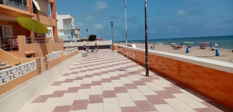 Foto a30d18fd-46b7-4b93-99b1-60a0cd44f97b. Casa adossada a calle calle cap de canet a Mareny de Barraquetes Sueca