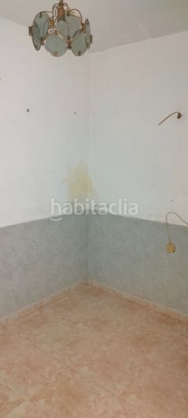Foto 1a3a8b32-b280-4dc5-940a-51cc22b72d57. Casa adossada a Llerena