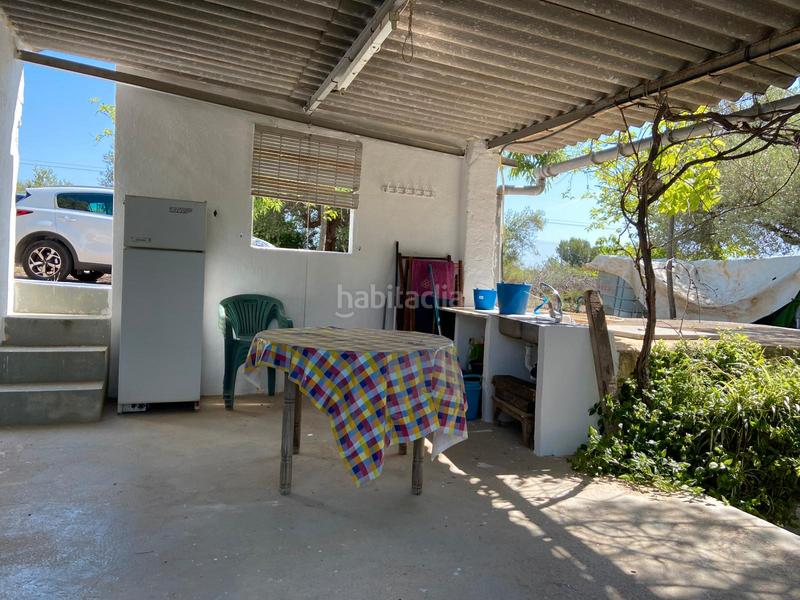 Foto d958555b-efe9-4782-b5e8-4e00ccf9dd88. Finca rústica masía con olivos en producción en Benlloc
