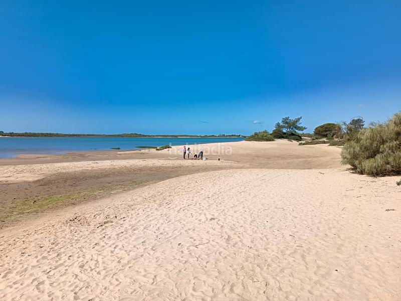 Foto 3baf411d-847c-4f1d-82be-ed7dc8cef943. Casa adosada espectacular casa pareada con piscina comunitaria a la venta – cartaya (urb. los enebros) lista para entrar a vivir en El Rompido