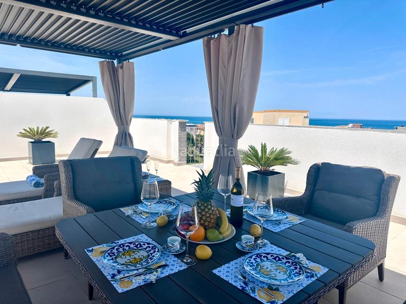 Foto 41633f23-cc36-4bcc-bdd3-207d482a253f. Piso comodidad junto al mar — con solárium, cenador y piscina en Oliva