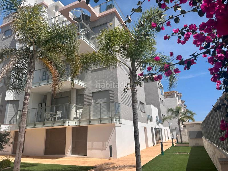 Foto abbbf379-3cc3-4621-abf7-d5e6b9efcb8a. Piso comodidad junto al mar — con solárium, cenador y piscina en Oliva