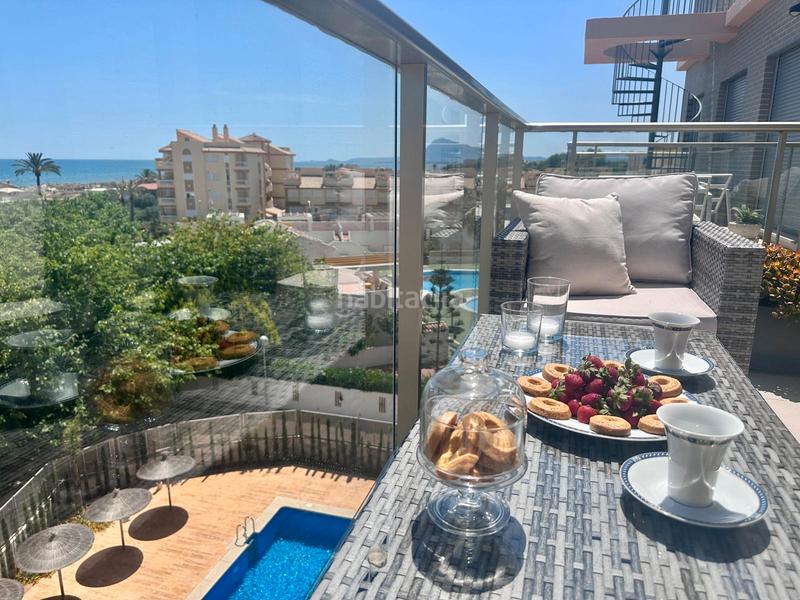 Foto ca0c8eb1-b06a-453e-a2ad-bb2d73f9f509. Piso comodidad junto al mar — con solárium, cenador y piscina en Oliva
