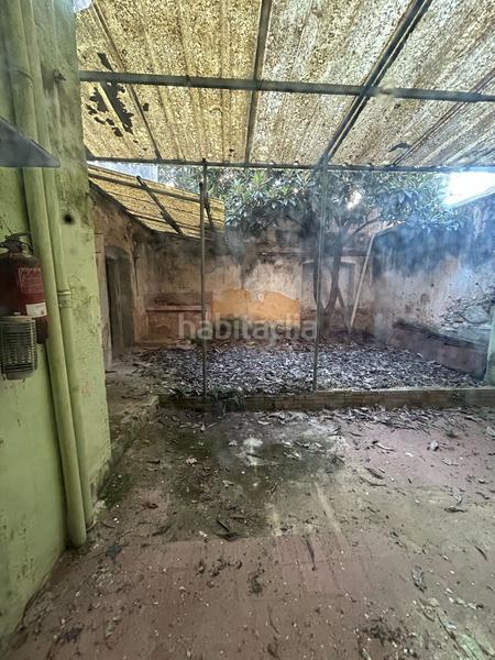 Foto df9d12c8-f9fa-4358-abc1-36675055a428. Casa adosada edificio , para reformar, con vistas y jardín privado en Santa Coloma de Farners