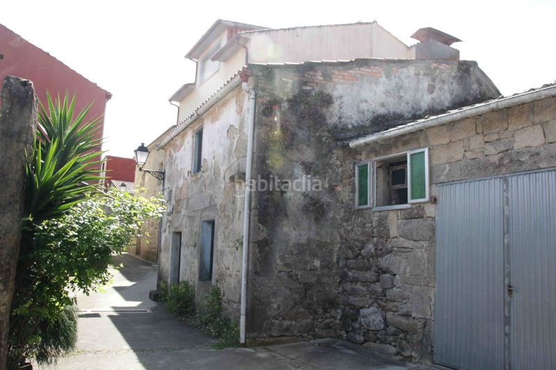 Foto 133a6b24-f277-4e6a-b41b-6913f86661db. Casa adossada a Dodro