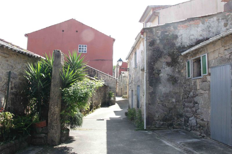 Foto 243f79ec-21e9-453a-a514-d873bb40f533. Casa adossada a Dodro