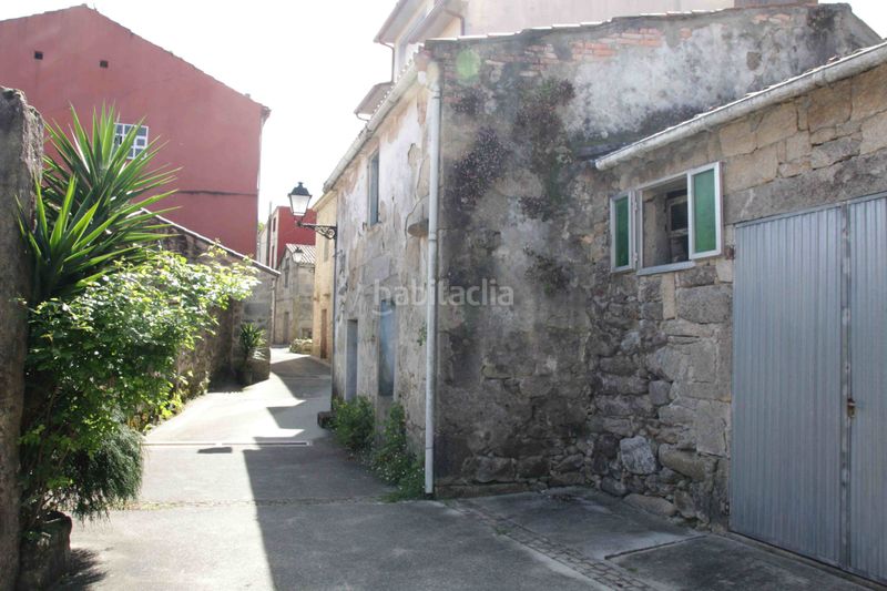 Foto 5315b30b-19a8-4f93-8a0b-c60f69bd31e2. Casa adossada a Dodro