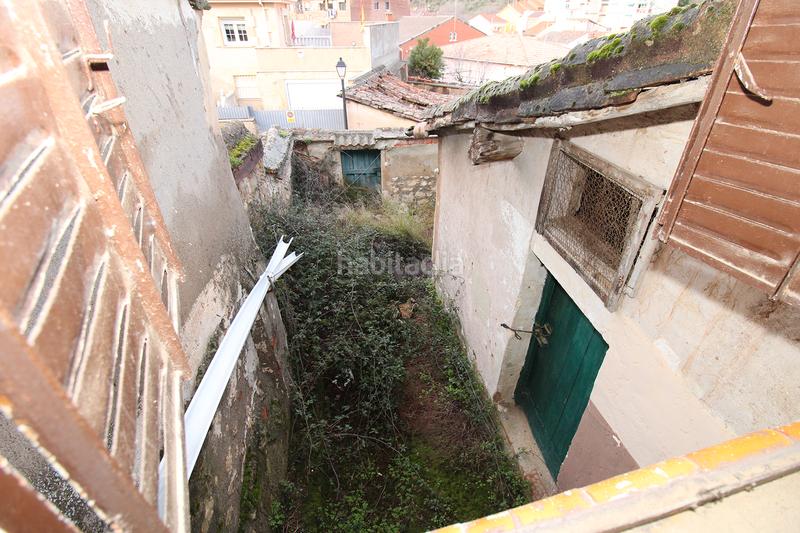 Foto eb50041f-aecc-48b9-814d-cb87f4752854. Casa adosada  de 2 plantas con terrenos en Torrelaguna
