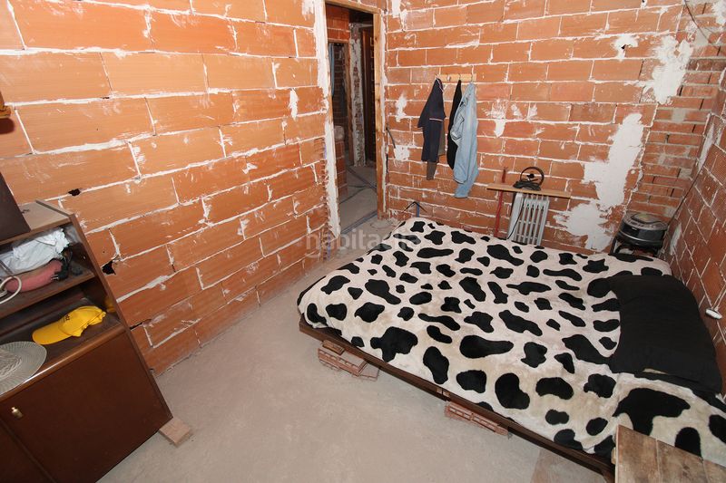 Foto f7be2dc7-e7c9-4e09-b9c8-30a714c2c38b. Casa adossada a Atazar (El)