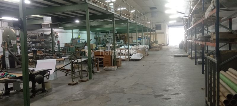 Foto ce6fbd9c-c304-40b5-b289-2f2c7b5f5869. Bâtiment à usage industriel dans carrer riu segura 25 dans Quart de Poblet