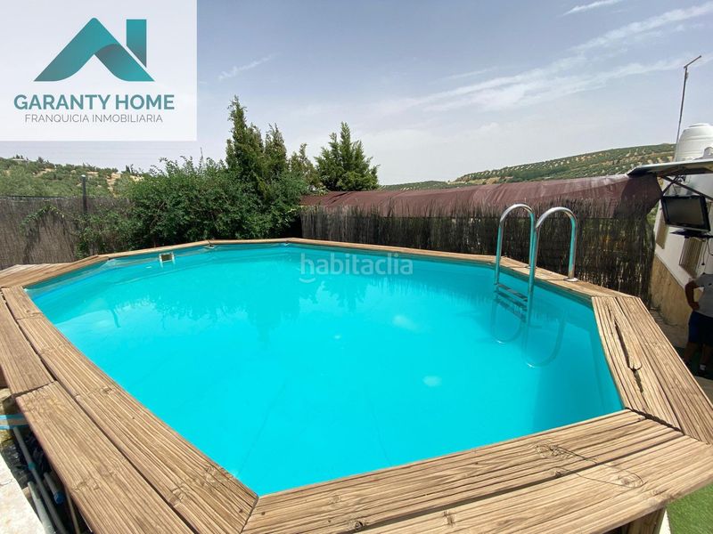 Foto cb0a8ab1-4554-4f3e-a228-bb119062c14e. Chalet finca con piscina y placas solares en Torredonjimeno