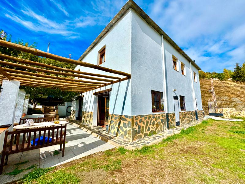 Foto f1f69927-5985-472c-bb8c-4c346e2c7f3d. Xalet amb xemeneia calefacció aparcament piscina a Bérchules