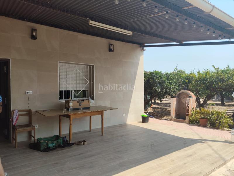 Foto 5ac2e189-3152-42bf-83a3-1fb7bec5aefa. Casa adosada  en algorós con frutales en Elche / Elx