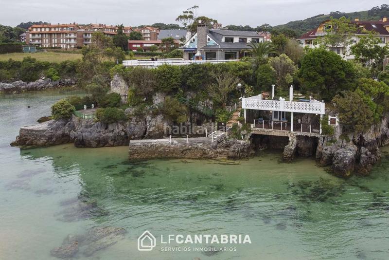 Foto f5db4760-f6c0-4011-81c5-56302c821d98. Chalet casa encima del mar en isla en Arnuero