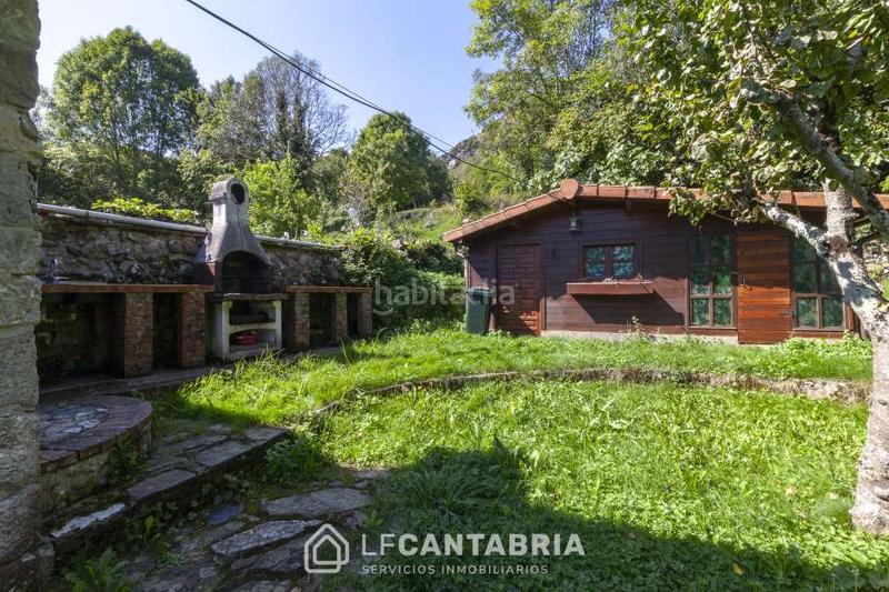 Foto 4a9f0fca-70ab-49cd-aca2-5b224e89d3e9. Casa  montañesa en el pueblo en Miera