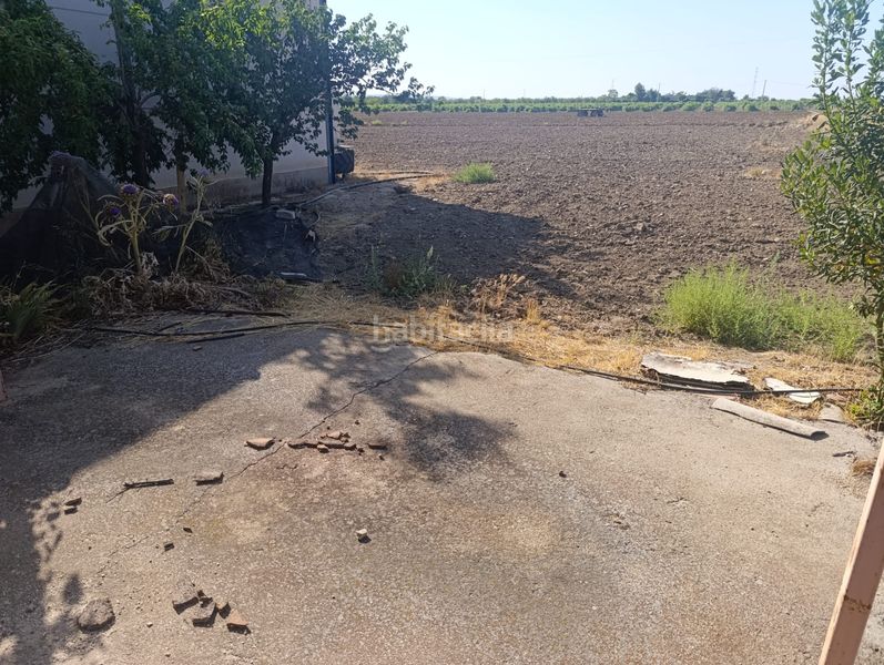 Foto 5ece0dcd-50c0-4377-9b8e-e2c5437214cb. Finca rústica oferta de nave y huerta en Mora