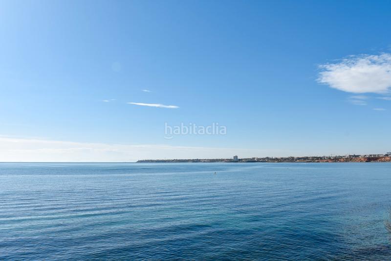 Foto da7ce792-db83-41b9-aadb-cd24b0f30984. Casa con parcheggio in Punta Prima Orihuela