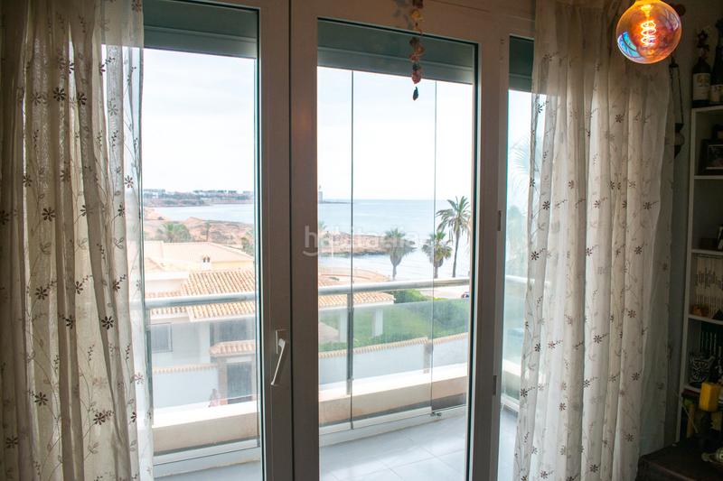 Foto 79ebb8bb-6627-472a-874d-f6dd56fff9d9. Piso descubra este piso en primera línea de mar, una auténtica joya inmobiliaria situada en el enclave más privilegiado de la costa de en Orihuela