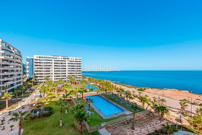 Foto 0ce0405d-306a-497e-8f50-d76f6e7ab8db. Apartament amb aparcament piscina a Punta Prima Orihuela