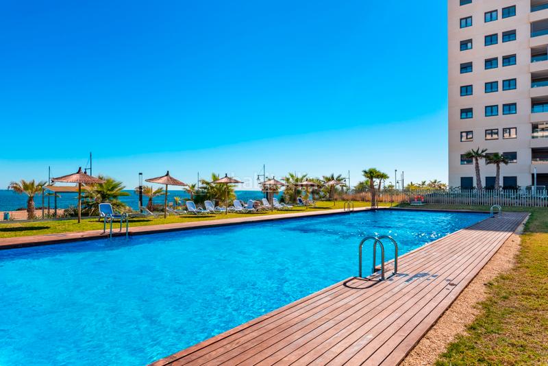 Foto 0fde43ae-8ad0-4d62-865c-56ca03a34ebe. Apartament amb aparcament piscina a Punta Prima Orihuela