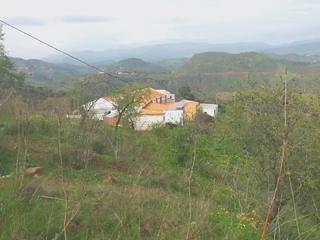 Finca rústica a Almogía. Parcela rústica de 35.000 m² con vivienda y vistas abiertas