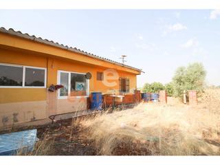 Xalet en Pedanas de Badajoz. Venta de una parcela con vivienda en botoa