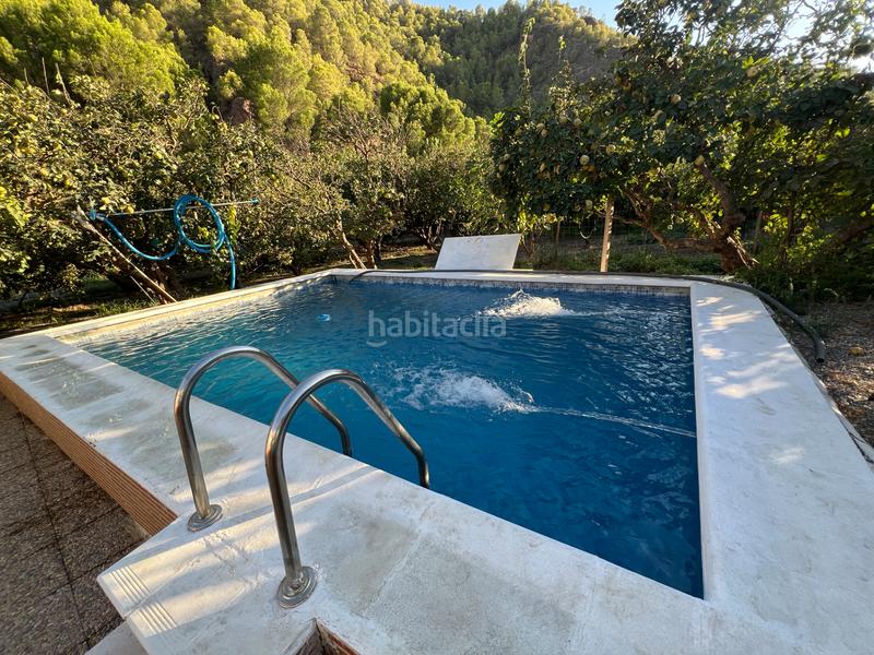 Foto 962c27cb-b24a-4b11-8fa9-1cc55de5bbb9. Masia amb xemeneia calefacció aparcament piscina a Órgiva