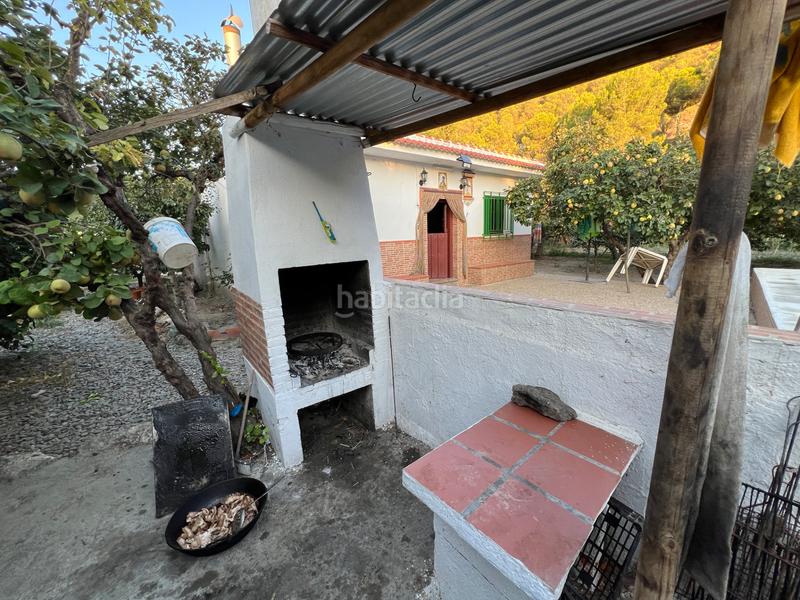 Foto c9d7818d-0f40-4f2f-94f3-d32aa02ca379. Masia amb xemeneia calefacció aparcament piscina a Órgiva