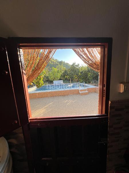 Foto fa42d550-bd28-49c9-af3b-eaabd5737f17. Masia amb xemeneia calefacció aparcament piscina a Órgiva