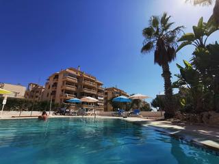 Apartament a El Moncayo - El Pòrtic. Planta baja de 3 dormitorios a 50 m. de la playa, con piscina co