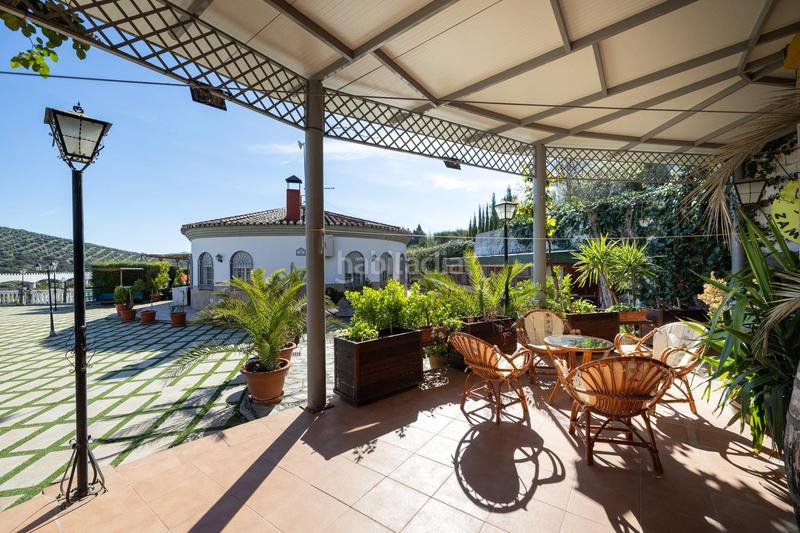 Foto 12b87b66-e51c-4568-9f28-2c4395e8b6f3. Chalet espectacular chalet con piscina, jardines y salón de fiestas en puerto lope ! en Moclín