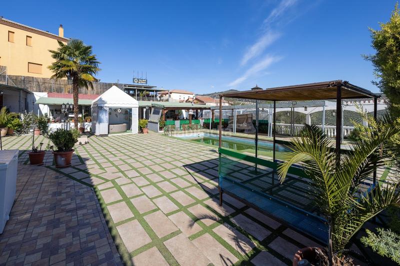 Foto 7b4ffc67-ad2d-41cc-865a-4450a3d9fe7d. Chalet espectacular chalet con piscina, jardines y salón de fiestas en puerto lope ! en Moclín