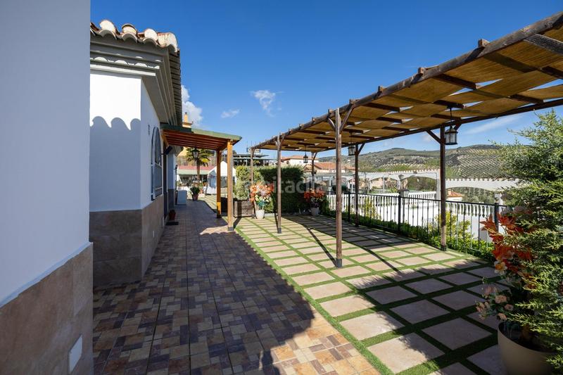 Foto afc78a09-e0b8-46c9-baf2-7456af361692. Chalet espectacular chalet con piscina, jardines y salón de fiestas en puerto lope ! en Moclín