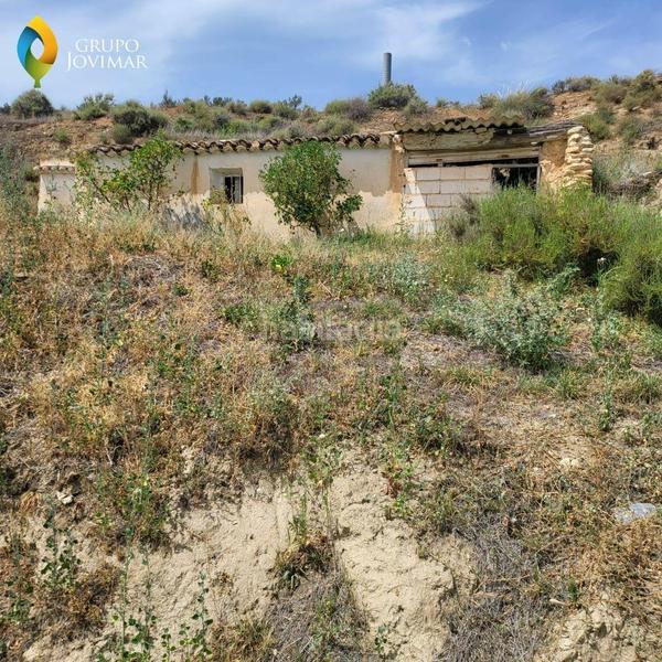 Foto 6887bd9a-3c01-44eb-97e8-9ebb85da6de3. Finca rústica en Caniles