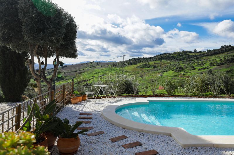 Foto 4d55a0dd-e832-4990-a1ec-8cc8a9e055dd. Masia amb xemeneia piscina a Ardales