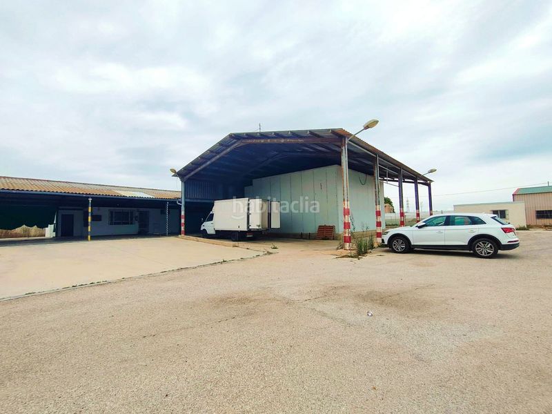 Foto bf659a6c-c05b-4eff-84ae-f08c0b9931c7. Nau industrial a Mareny de Barraquetes Sueca