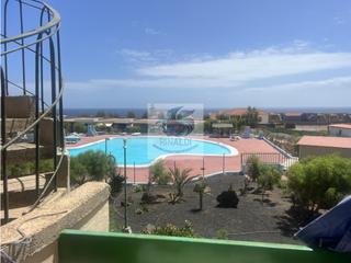 Appartement in Caleta de Fuste. Piso con vistas piscina y océano en bouganville costa de antigua