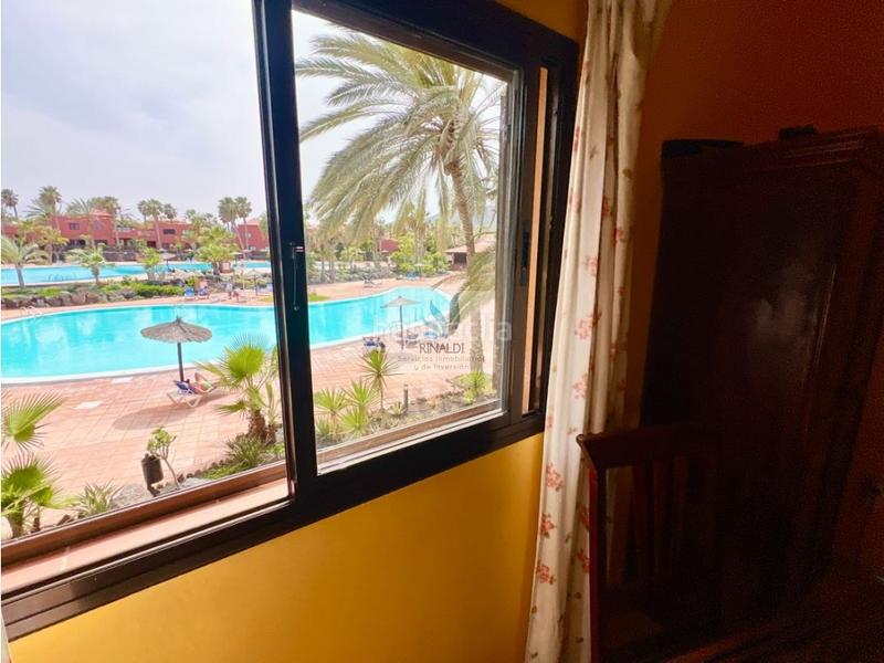 Foto e1e5e43a-68fa-49c7-905a-2bf9f84ef531. Apartamento estupendo apartamento frente piscina en oasis tamarindo 1 en Oliva (La)