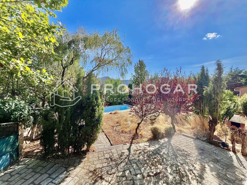 Foto 313775fa-291f-4d99-b9b7-1487c978f992. Xalet amb aparcament a Bustarviejo