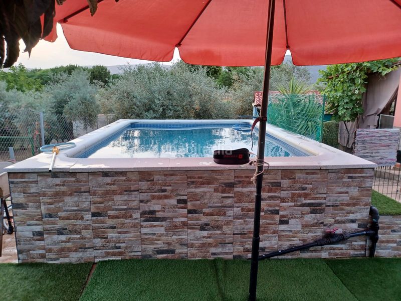 Foto d0b52280-803e-4198-bbbe-812223bf40e1. Xalet amb xemeneia piscina a Logrosán