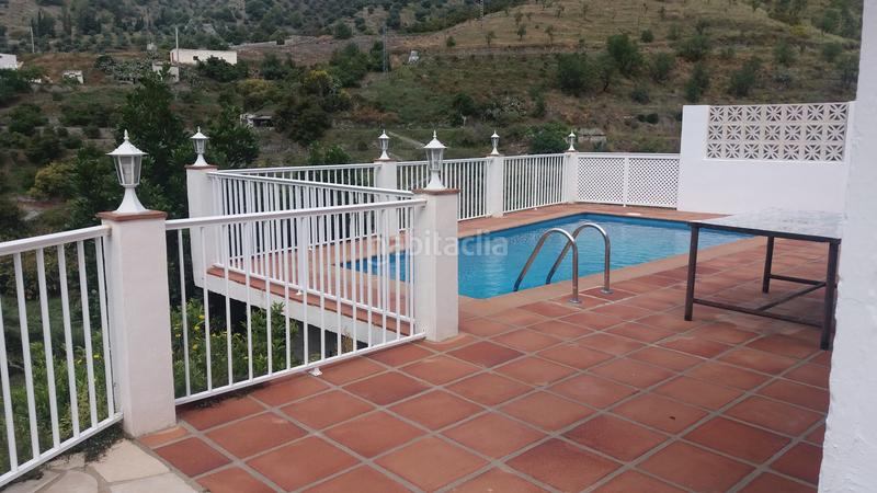 Foto 21d5c9fc-8d0c-428c-ba0a-79dc1ea950d7. Maison jumelée avec cheminée parking dans La Herradura Almuñécar