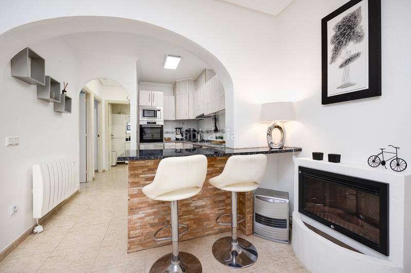 Foto db1f1454-e43e-42a9-835b-106537508f98. Apartamento planta baja con jardín privado y piscina comunitaria en la fiesta quesada en Rojales