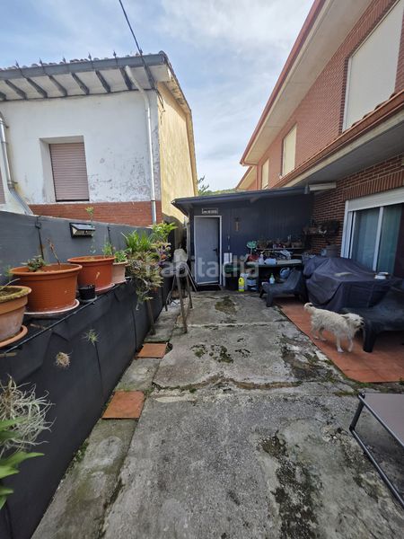 Foto 731ac7ca-6c36-447a-84b1-7dc419e18ed1. Casa adossada amb calefacció aparcament a Reocín
