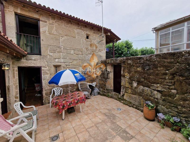 Foto a3adffc5-4134-477e-a3dc-dd35bff3c4a9. Casa adossada a Maside