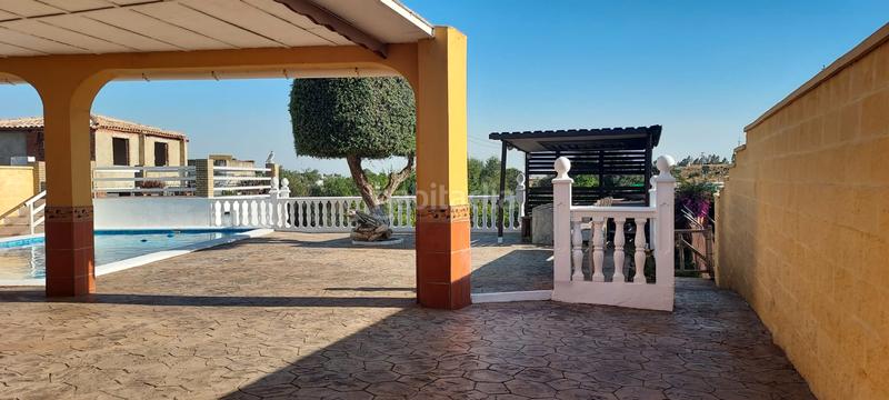 Foto 0f704695-a5ba-4e9b-a451-0fe4e17d1d20. Finca rústica terreno con casa en la puebla del rio en Puebla del Río (La)