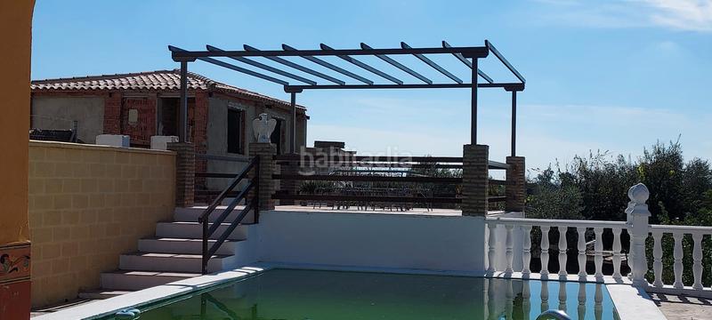 Foto 53849799-c8bc-446b-9110-a59a96a512f8. Finca rústica terreno con casa en la puebla del rio en Puebla del Río (La)