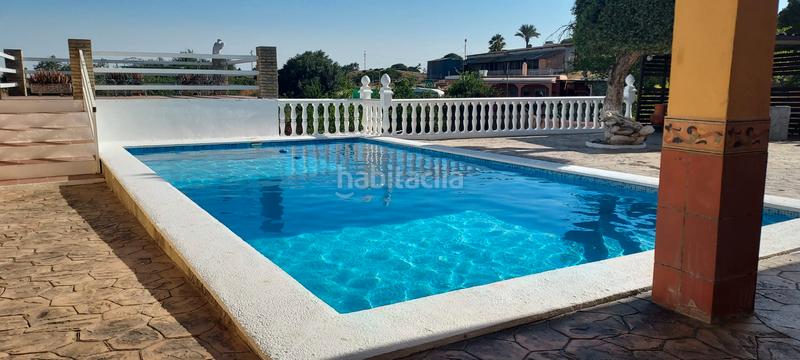 Foto 62fce00f-f2c1-4f71-8059-c654dcc8a041. Finca rústica terreno con casa en la puebla del rio en Puebla del Río (La)