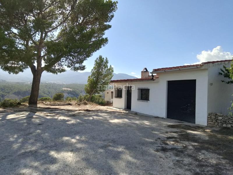 Foto 9e3c3c0d-534a-4c77-a8b9-1b03c46d206a. Rural plot in Tibi