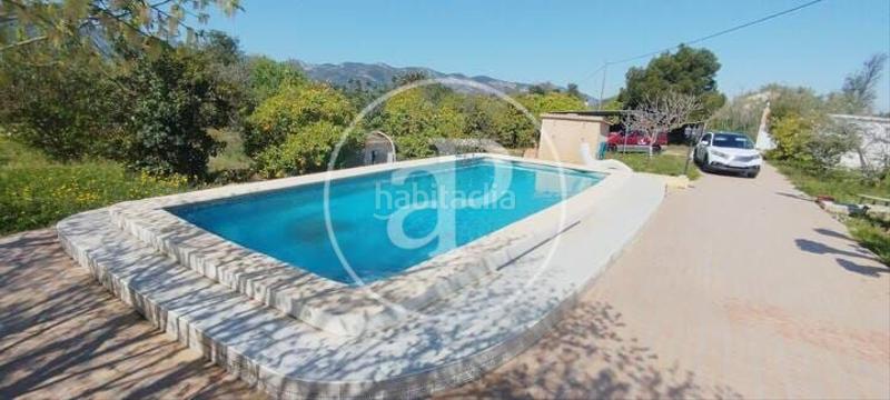 Foto 7b7405ca-a939-4fe2-817f-ee9ed433d724. Casa aparellada amb calefacció aparcament piscina a Gandia