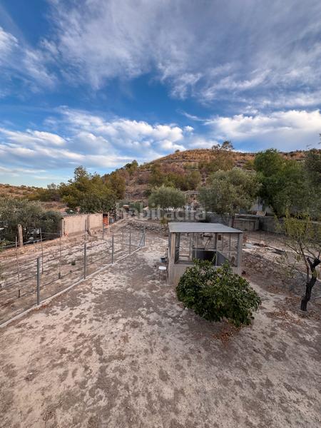 Foto d9ecdebb-68b8-4f4f-b628-a6c335de1036. Location chalet avec cheminée parking piscine dans Peña de las Águilas Elche / Elx